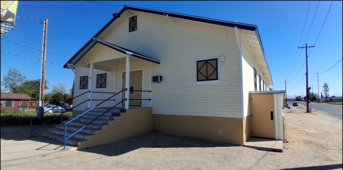The same front entry repainted with clean steps and rails